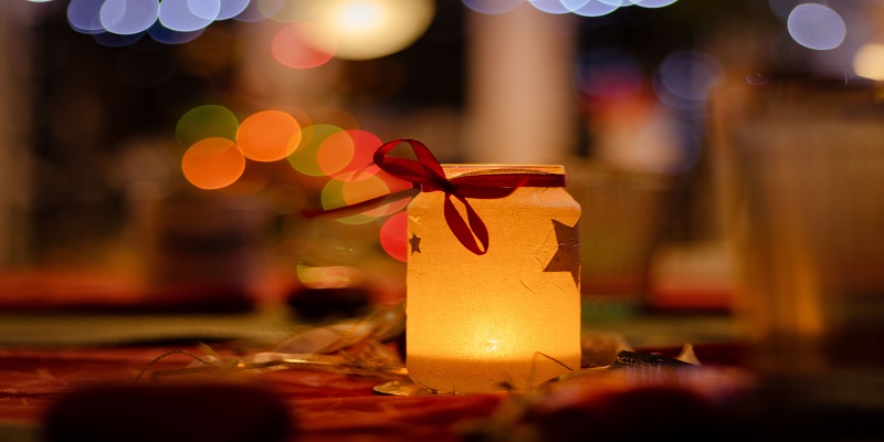 Memorial candle lantern representing compassionate cremation services in a warm remembrance setting