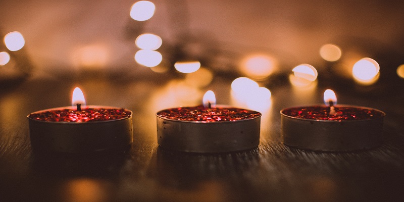Warm memorial candles representing compassionate cremation services in a peaceful setting